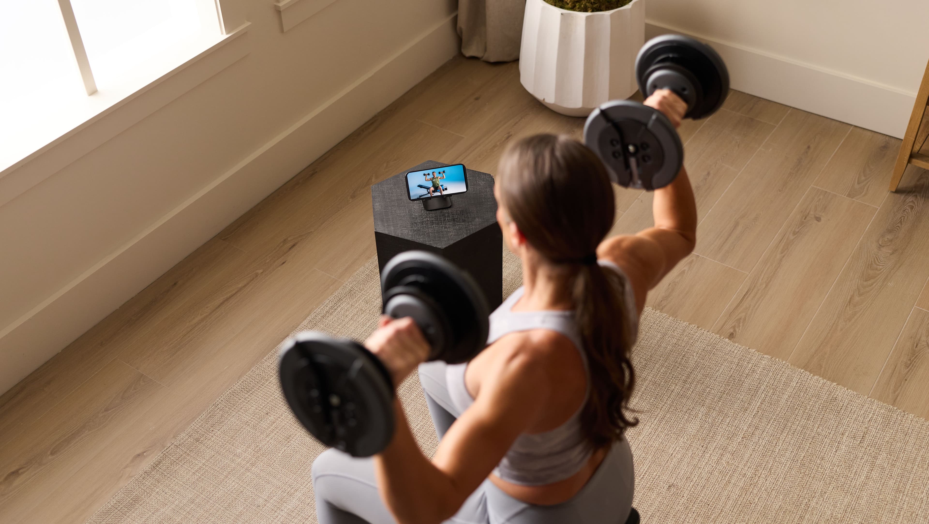 See the iFIT Personal Trainer app guiding a strength workout right from a phone, no equipment setup or gym required to get started.